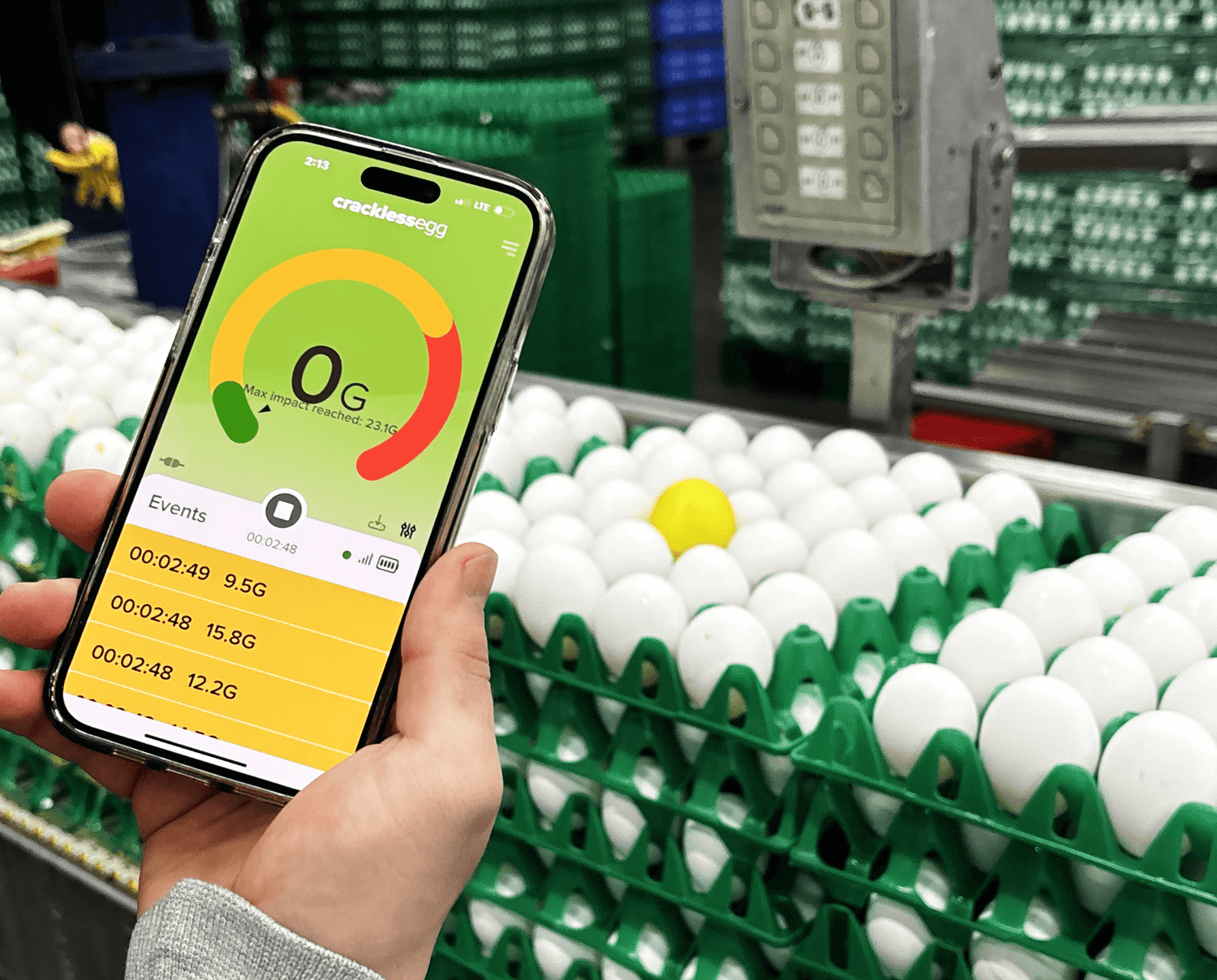 Farmer using CracklessEgg app on mobile photo to monitor egg breakage insights
